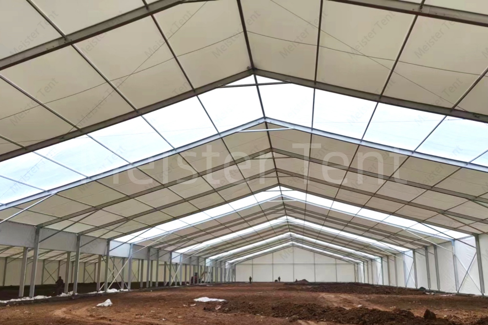 Why tents are chosen over traditional concrete structure warehouses?