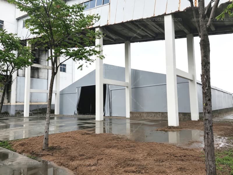 Industrial Storage Tent Beside Factory Building