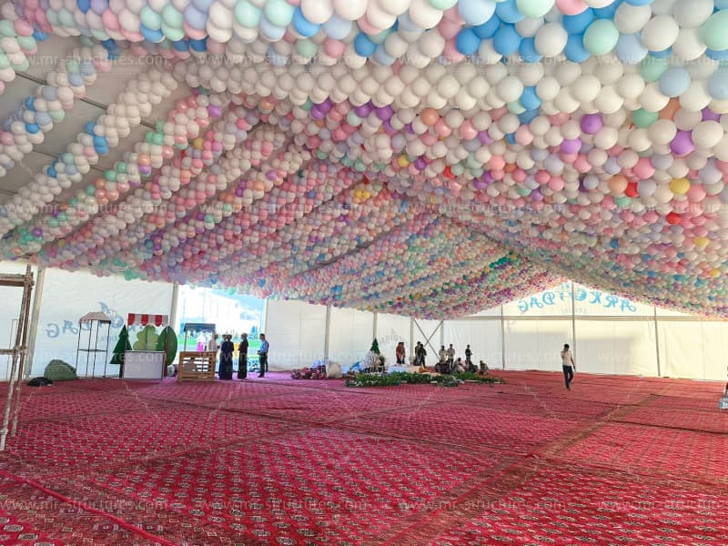 marquee event tent with ceiling balloons
