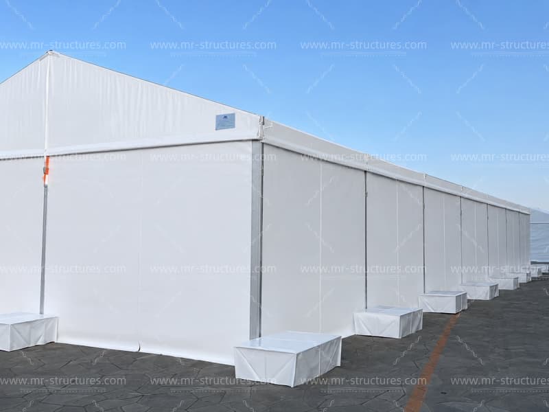 Large outdoor event tent with solid PVC sidewalls