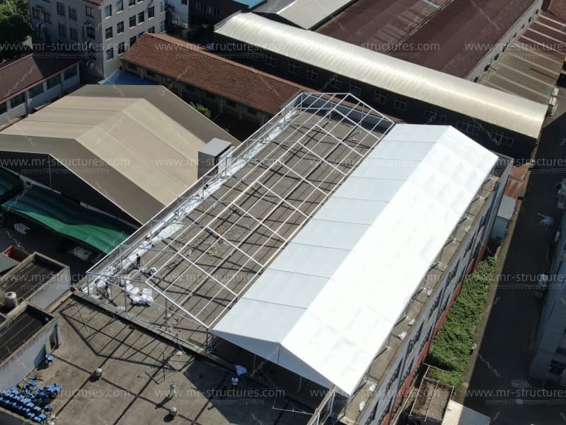 white warehouse tent aerial drone view